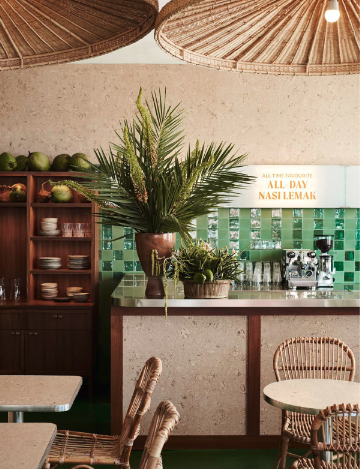 Green tiled counter with tropical plants