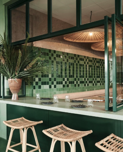 Bar area with woven lights and green mosaic wall